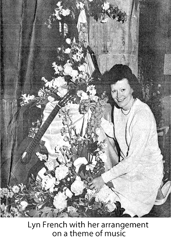 Lyn French with her arrangement on a theme of music